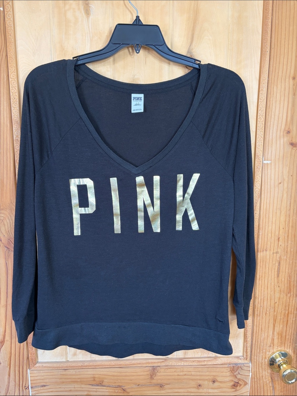 PINK Victoria's Secret Black Long Sleeve V‑Neck Top with Gold Logo
